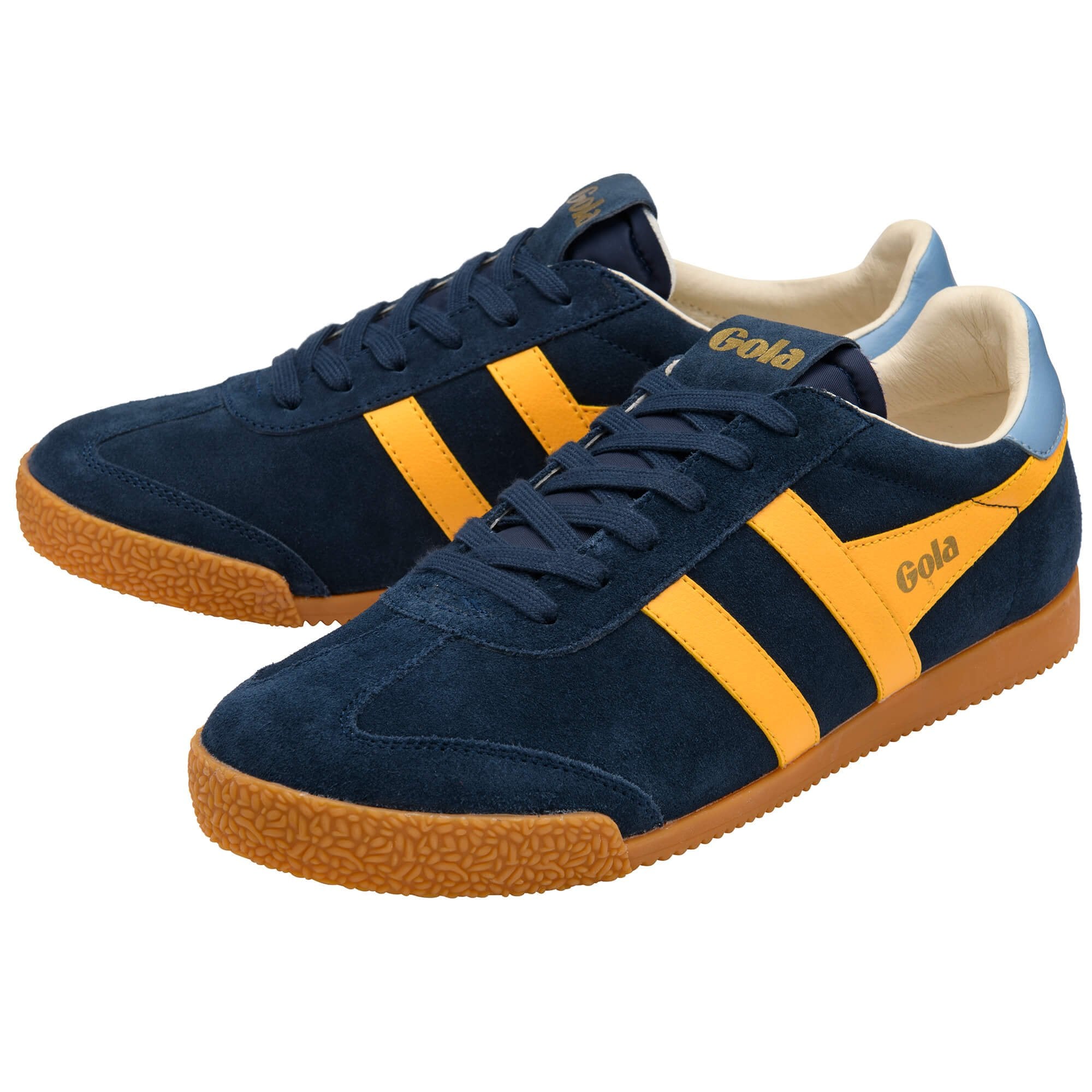 Navy blue trainers with yellow stripes and brown soles on a white background