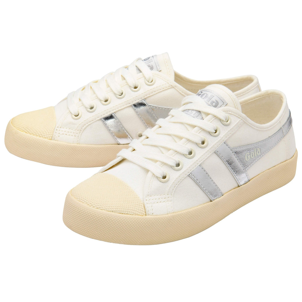Pair of white Gola trainers with beige and silver accents on a white background