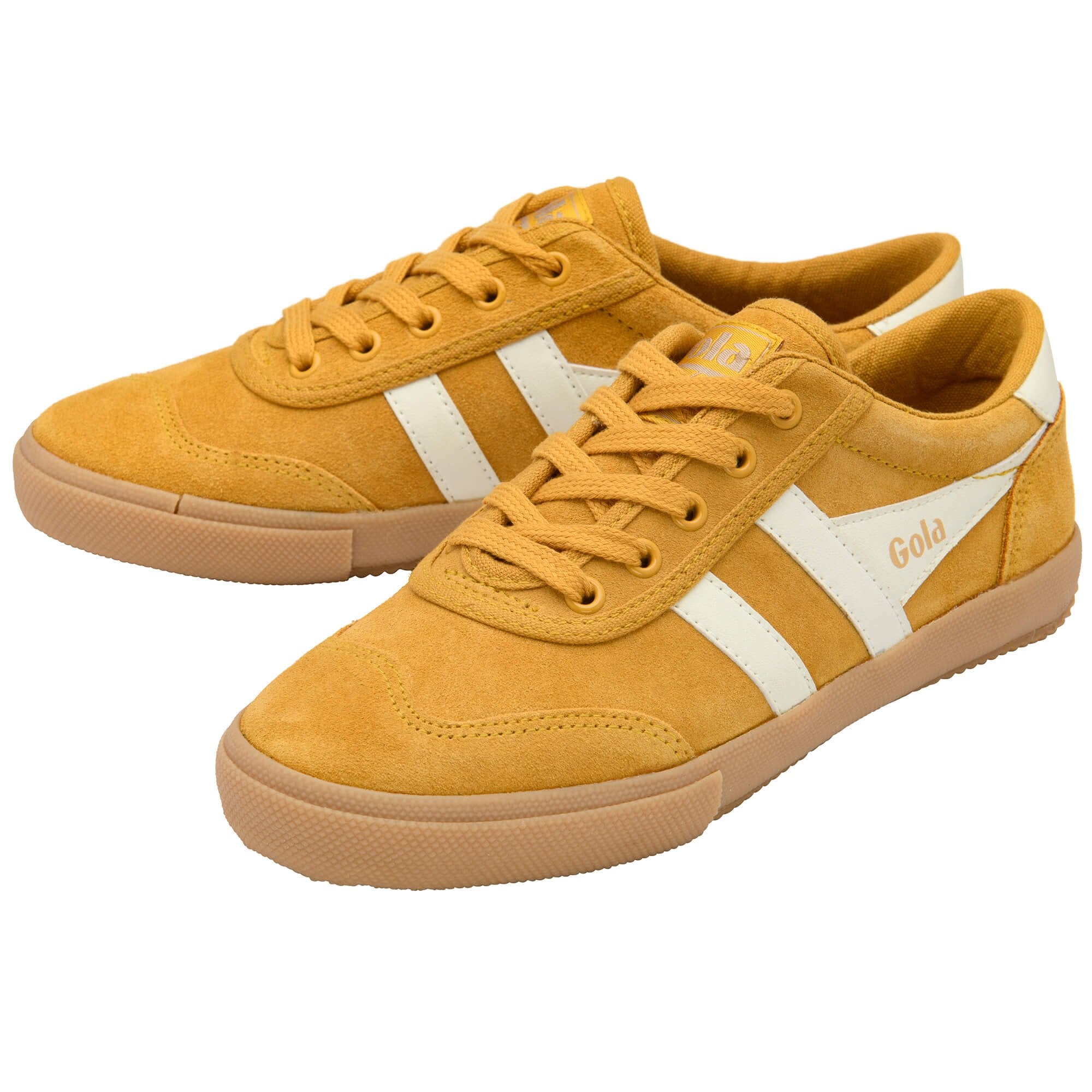 Yellow Gola trainers with white stripes on a white background