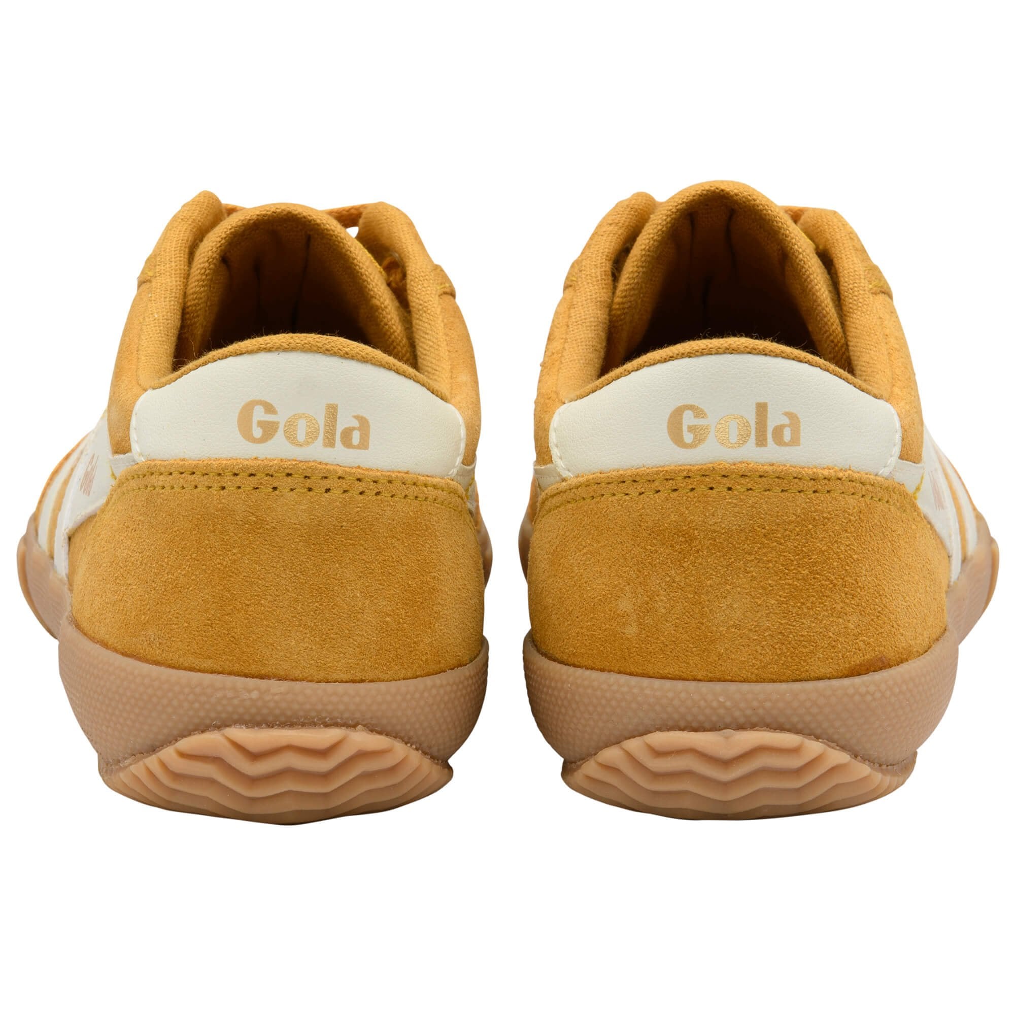 Pair of yellow Gola trainers on a white background