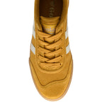Yellow Gola trainer with white stripes on a white background