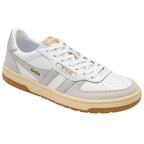 White Gola trainer with gold branding and light grey accents on a white background