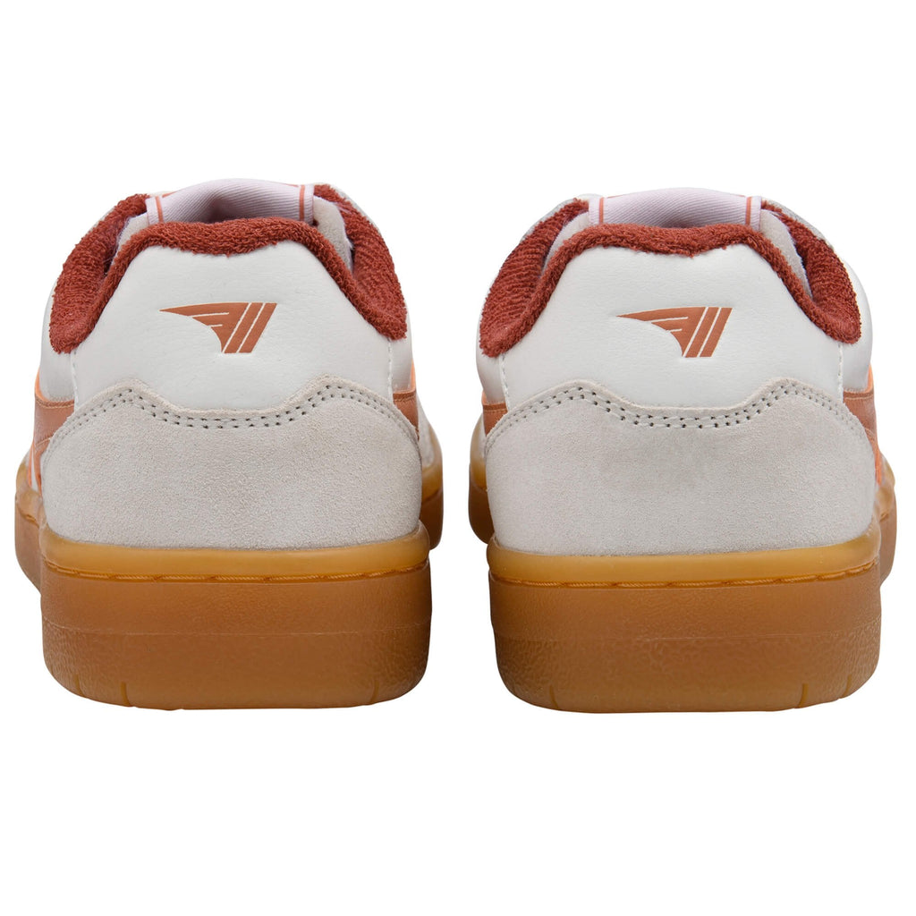 White Gola trainers with gum soles and red accents on a white background