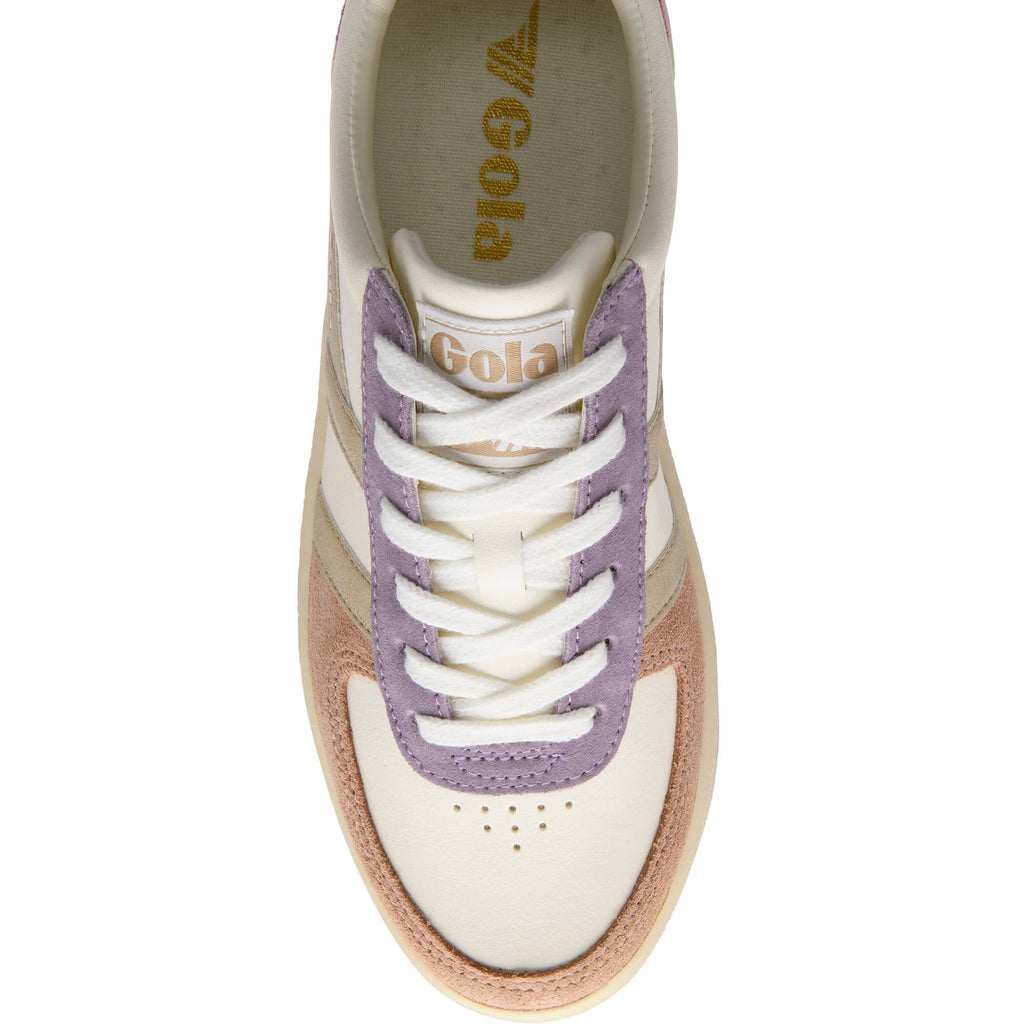 Gold Gola trainer with purple accents and white laces on a white background
