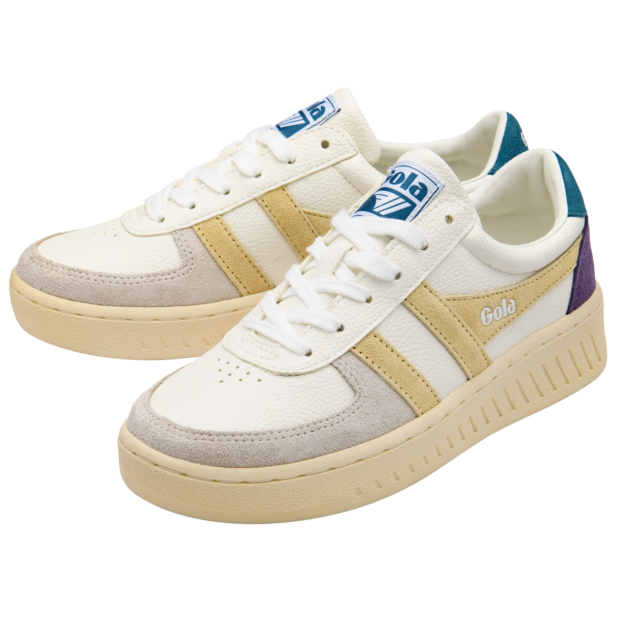 Pair of Gola trainers in white with yellow stripes, blue heel tab and purple accents on a white background
