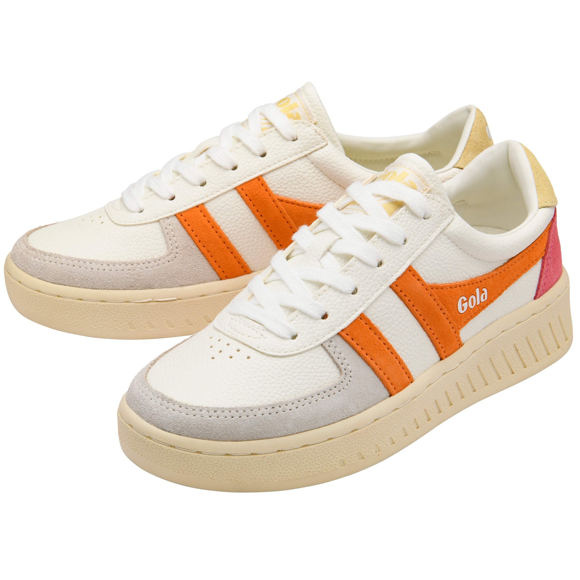 White Gola trainers with orange and pink accents on a white background