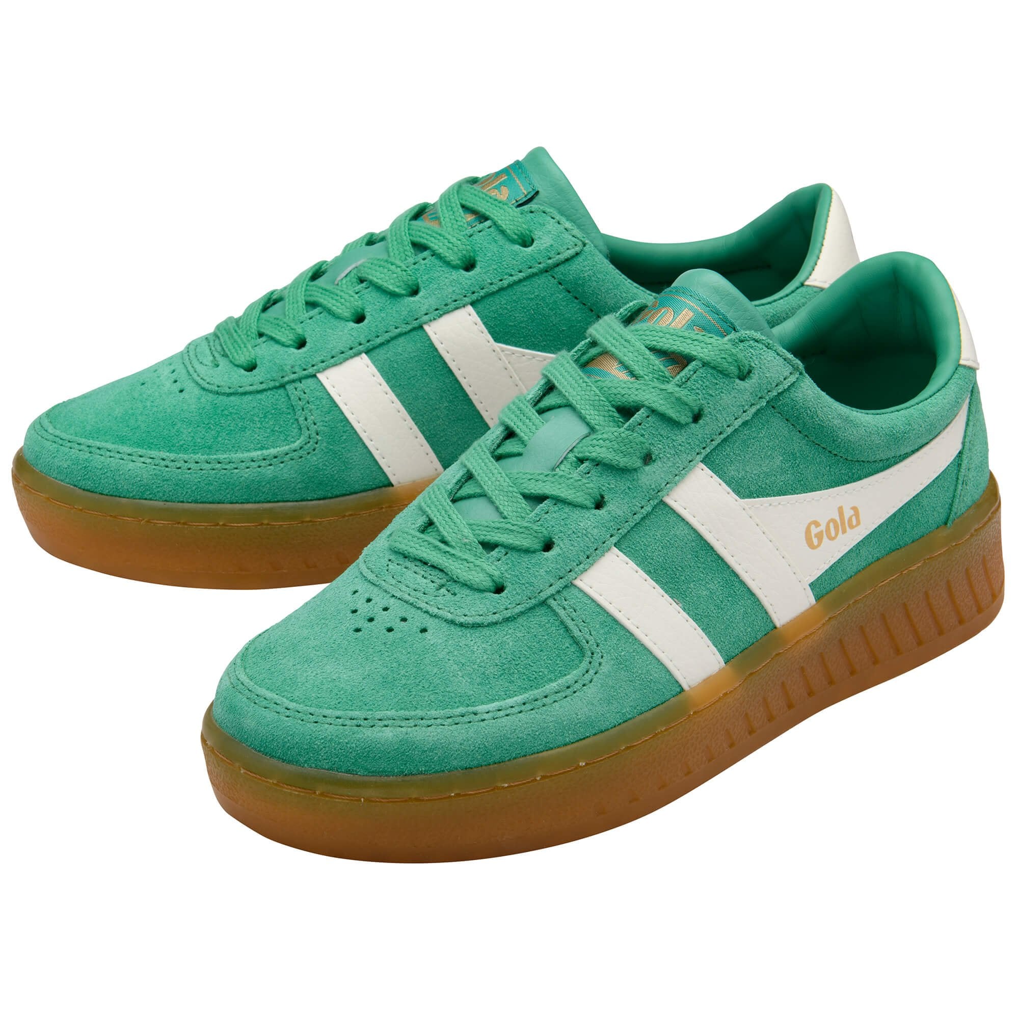 Pair of Gola trainers in green with white stripes and gum soles on a white background