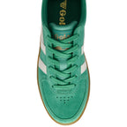 Green Gola trainer with white stripes on a white background