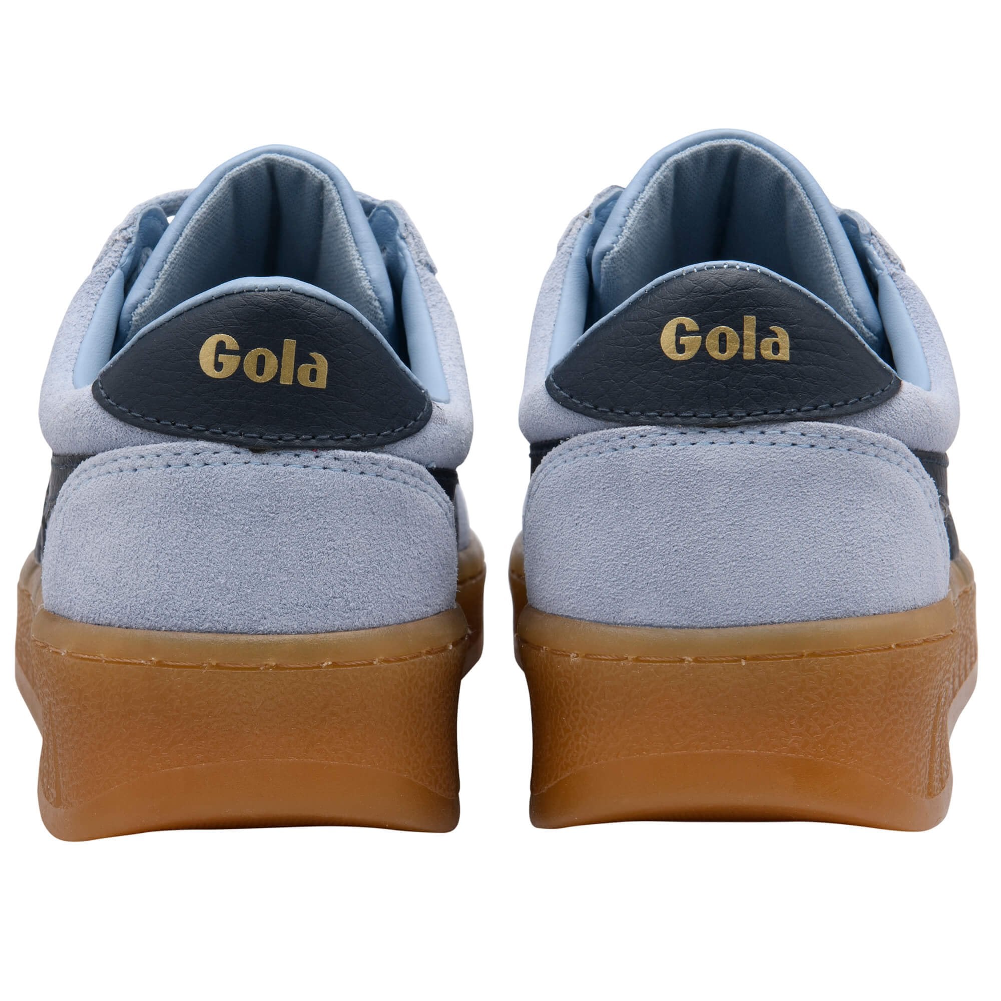 Pair of blue Gola trainers with brown soles on a white background