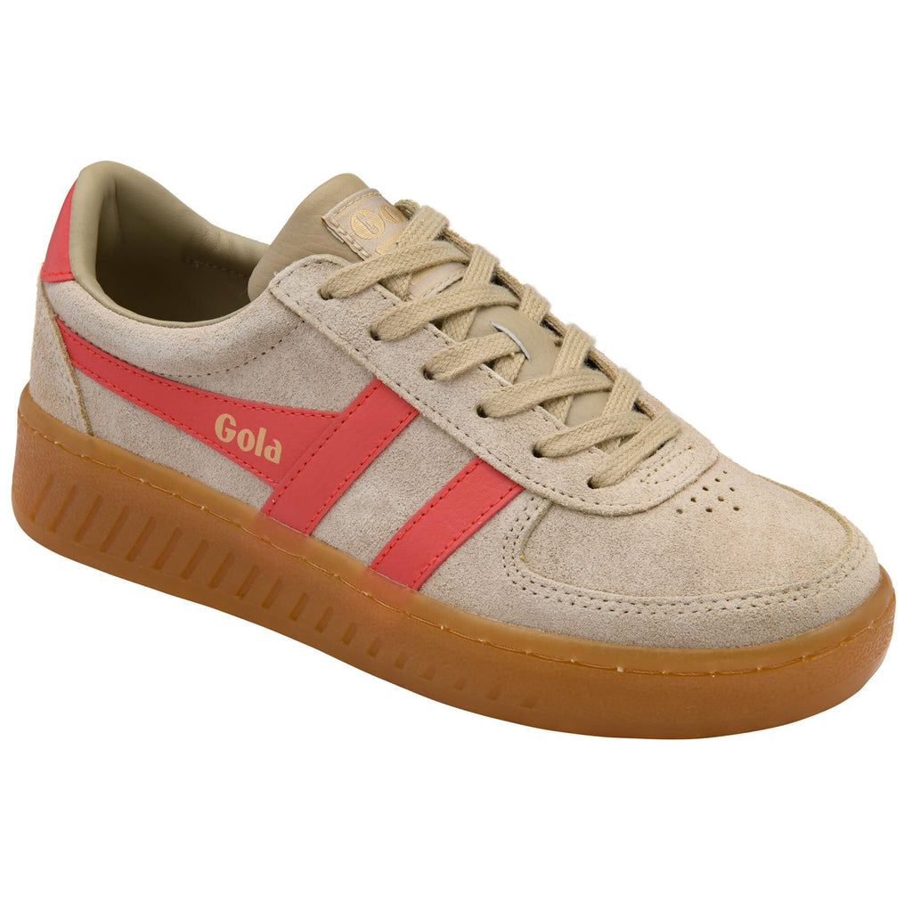 Gola trainer in beige with red side stripes and a gum sole on a white background