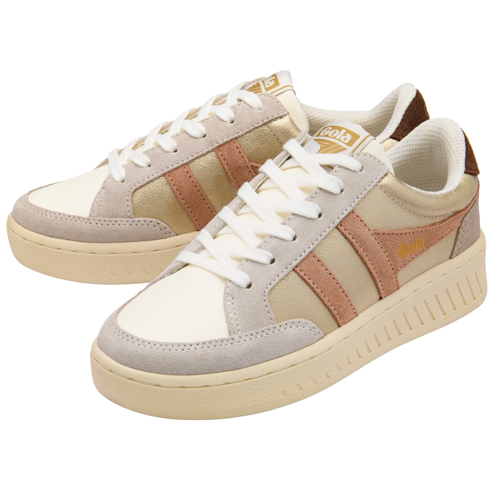Pair of Gola trainers in off-white, gold, and light brown with white laces on a white background