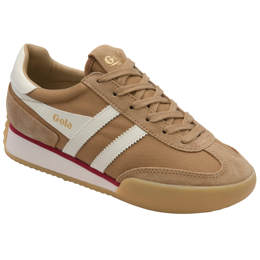 Tan trainer with white and red accents on a white background
