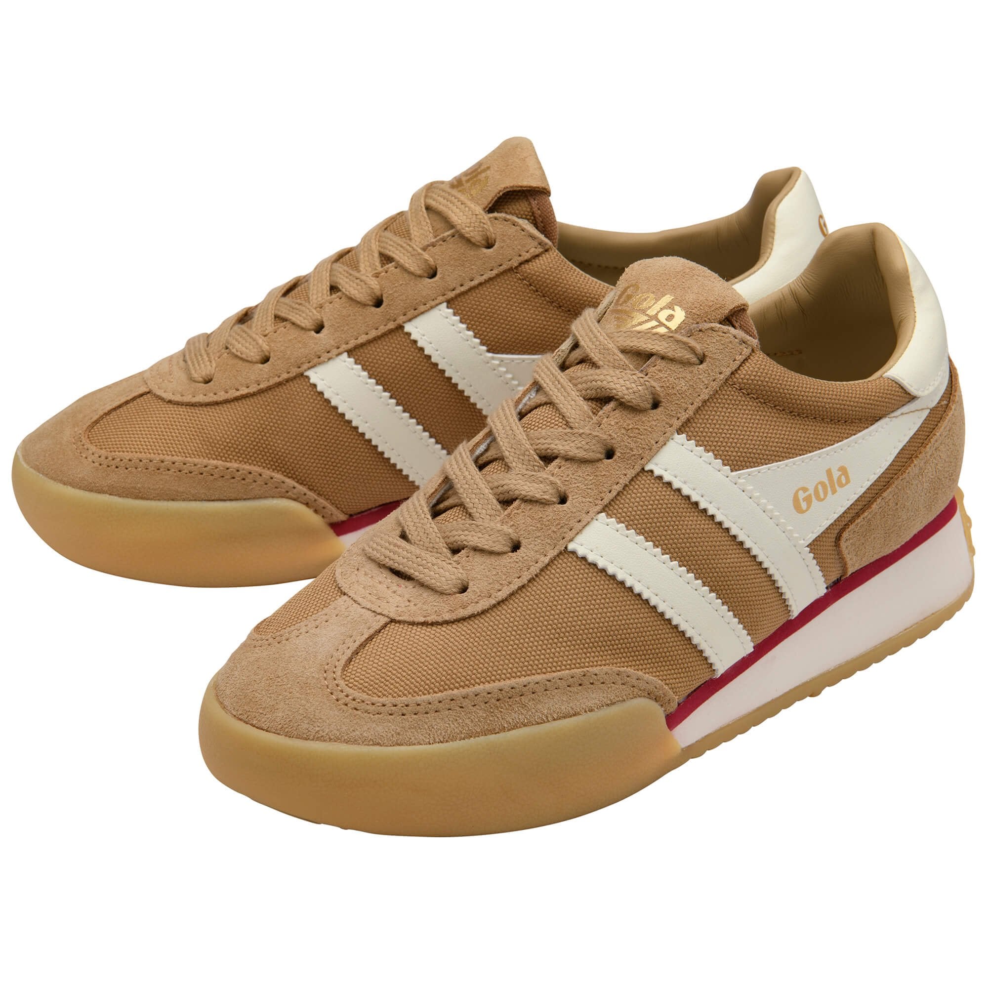 Pair of tan trainers with white stripes on a white background