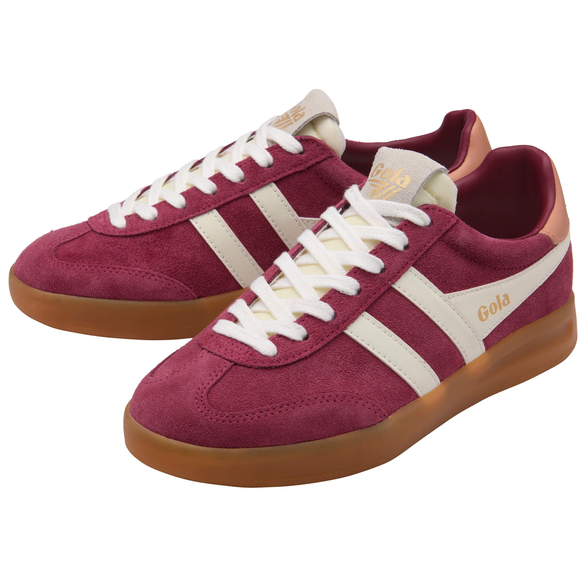 Maroon trainers with white stripes and brown soles on a white background