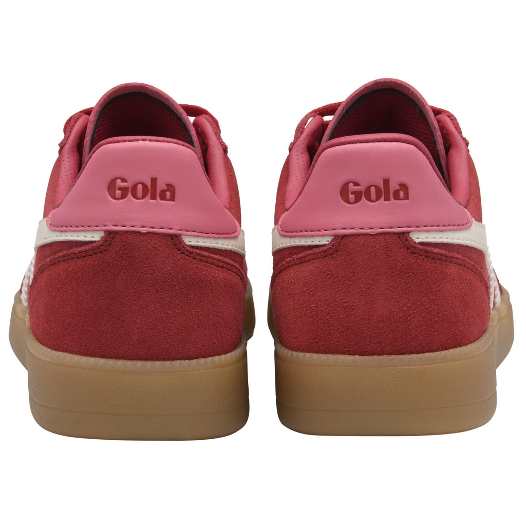 Pair of Gola trainers in red with pink heel tab and gum sole on a white background