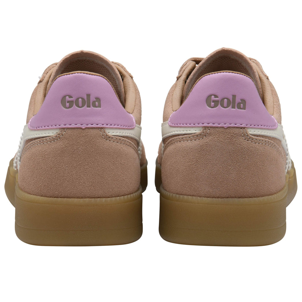 Pair of beige Gola trainers with pink accents and gum sole on a white background
