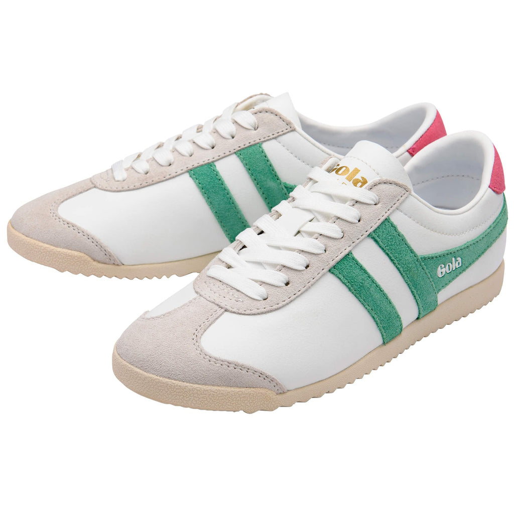 Pair of white Gola trainers with green stripes and beige accents on a white background