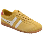Yellow Gola trainer with white stripes and red accents on a white background
