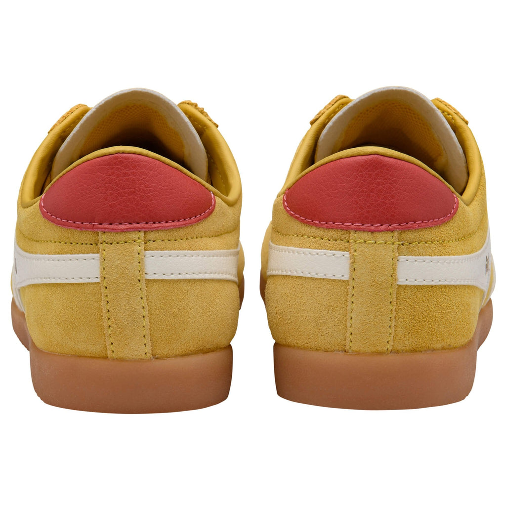Yellow Gola trainers with red accents on a white background