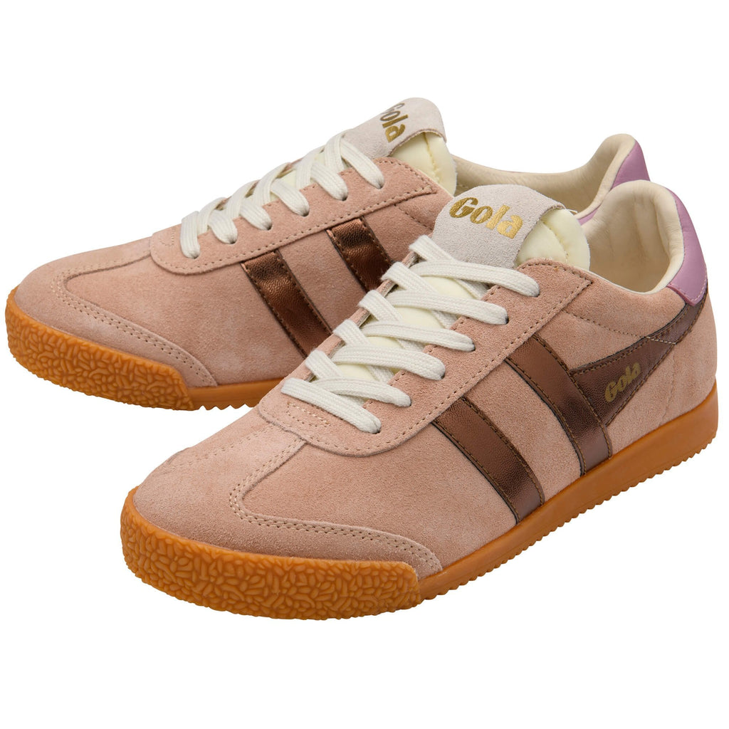 Pair of beige trainers with brown accents on a white background