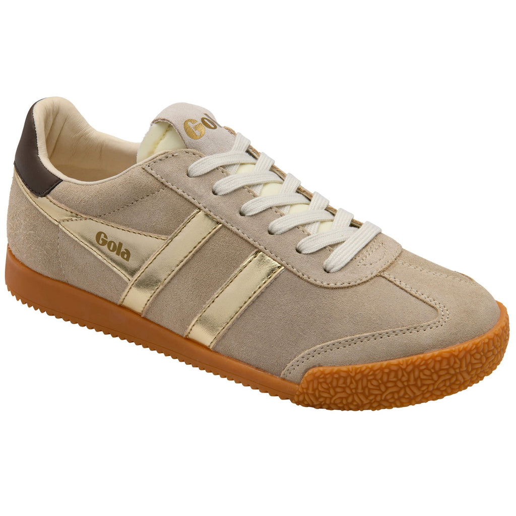 Beige trainer with brown sole on a white background