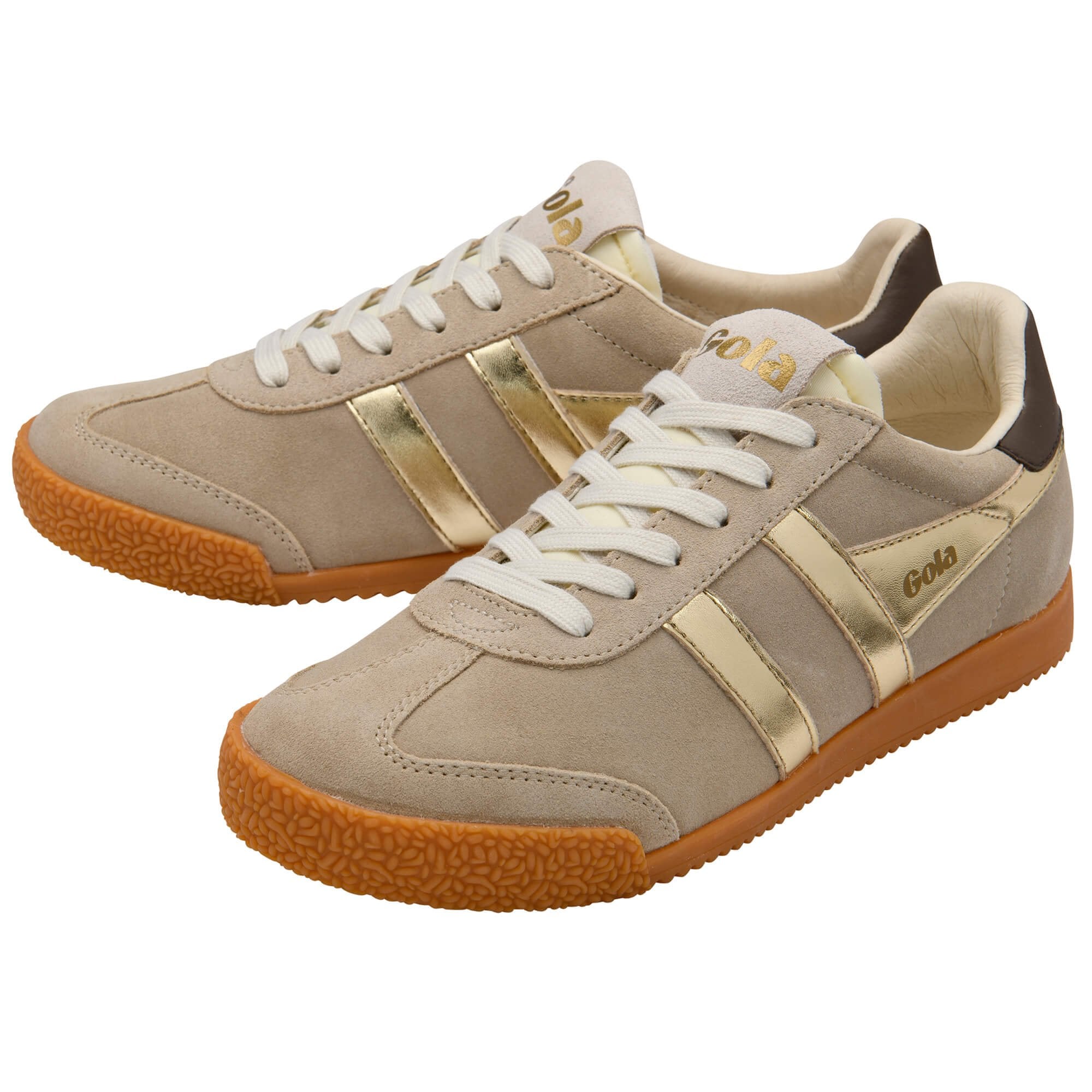 Beige trainers with gold accents on a white background