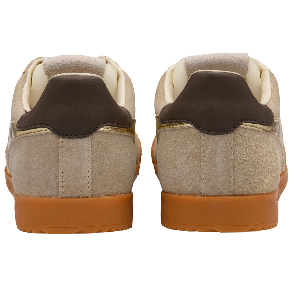 Pair of brown and beige trainers on a white background
