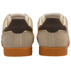 Pair of brown and beige trainers on a white background