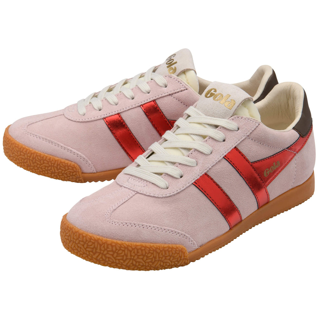 Pink trainers with red stripes and brown soles on a white background