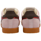 Pair of pink trainers with brown accents on a white background