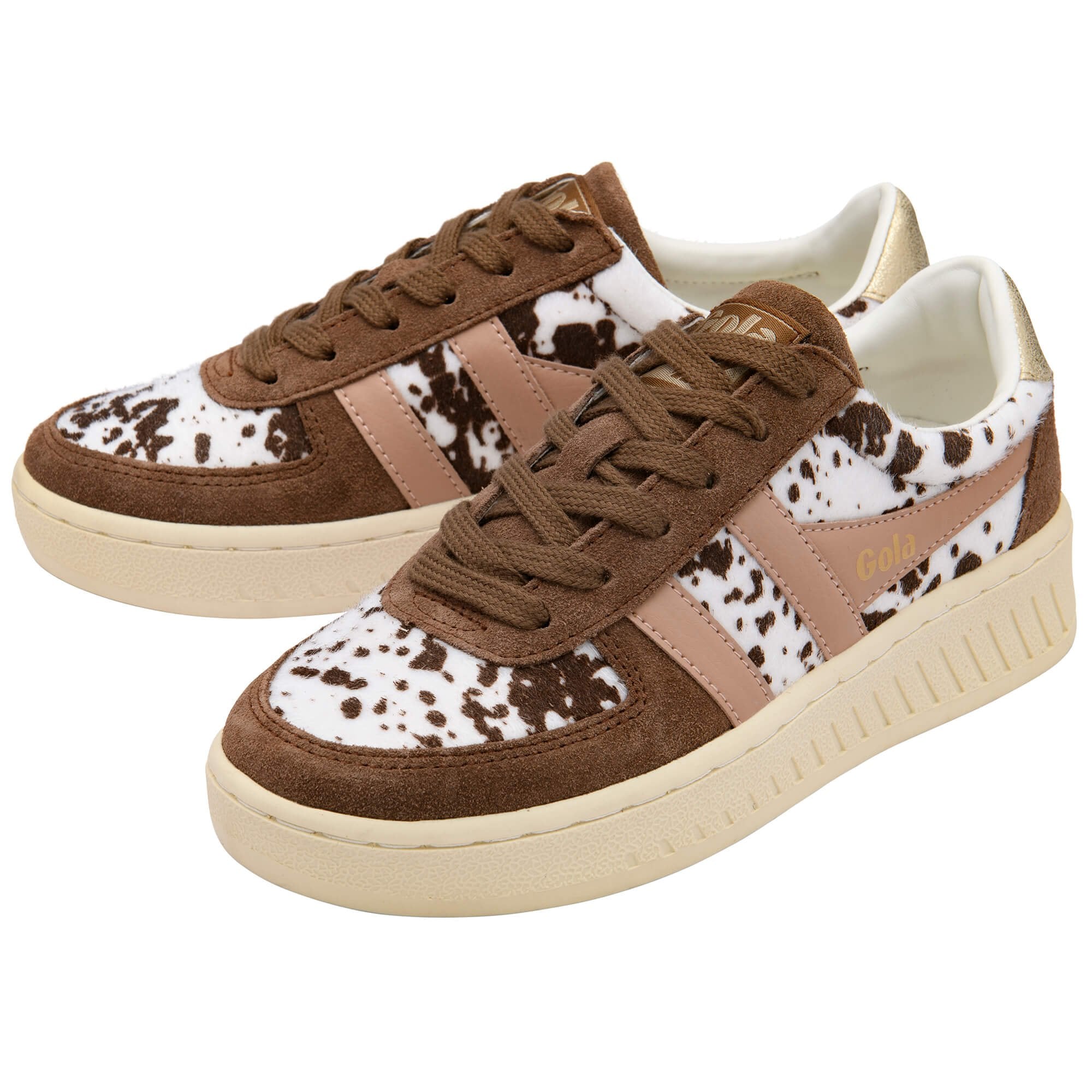 Pair of brown and white animal print Gola trainers on a white background