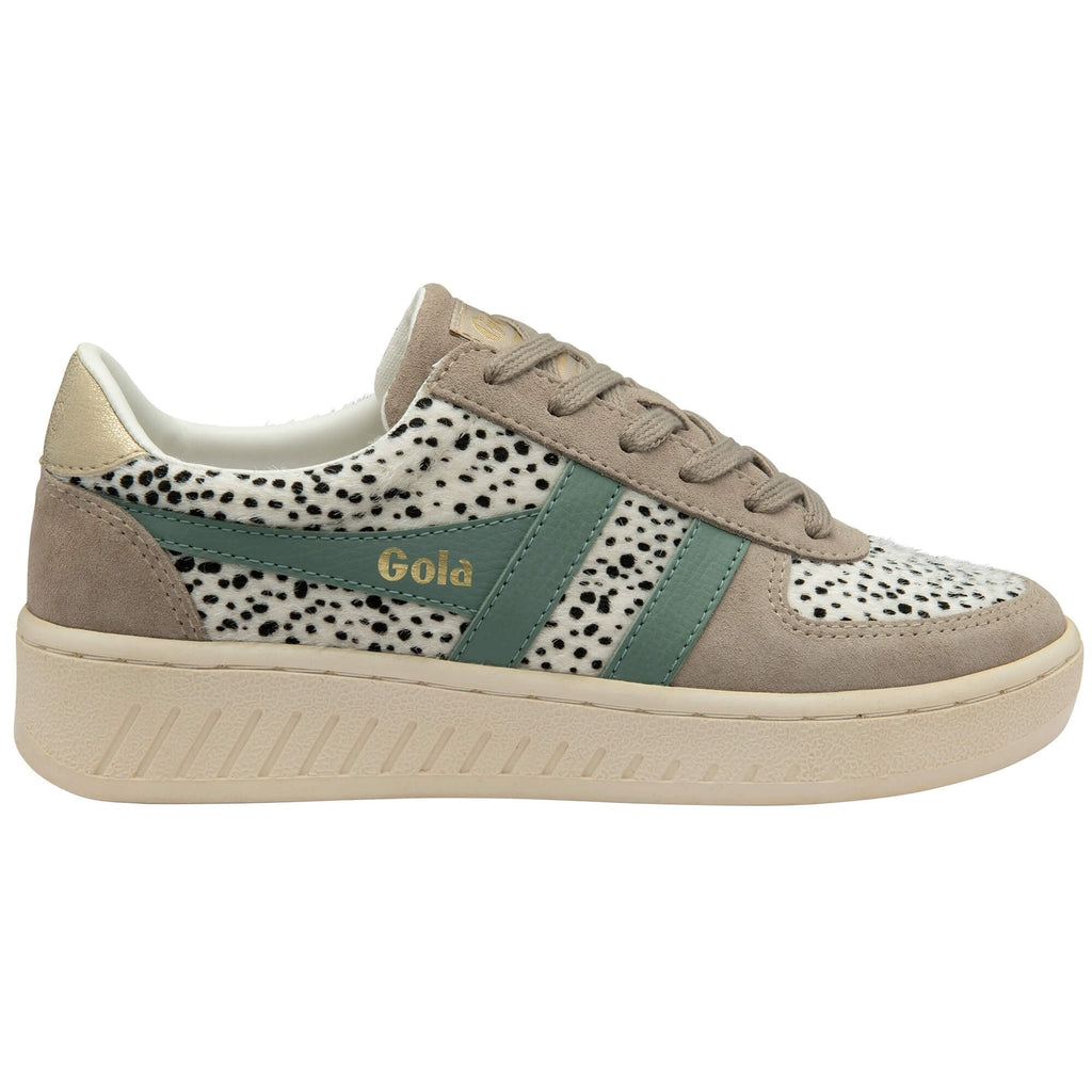 Gola trainer with animal pattern and green stripes on a white background