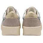 Pair of Gola trainers with animal print upper and green accents on a white background
