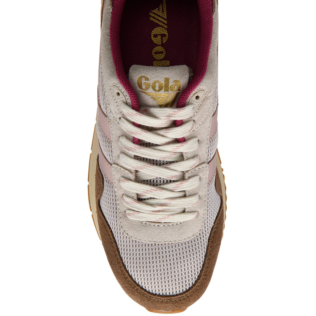 Gola trainer with brown sole and white laces on a white background