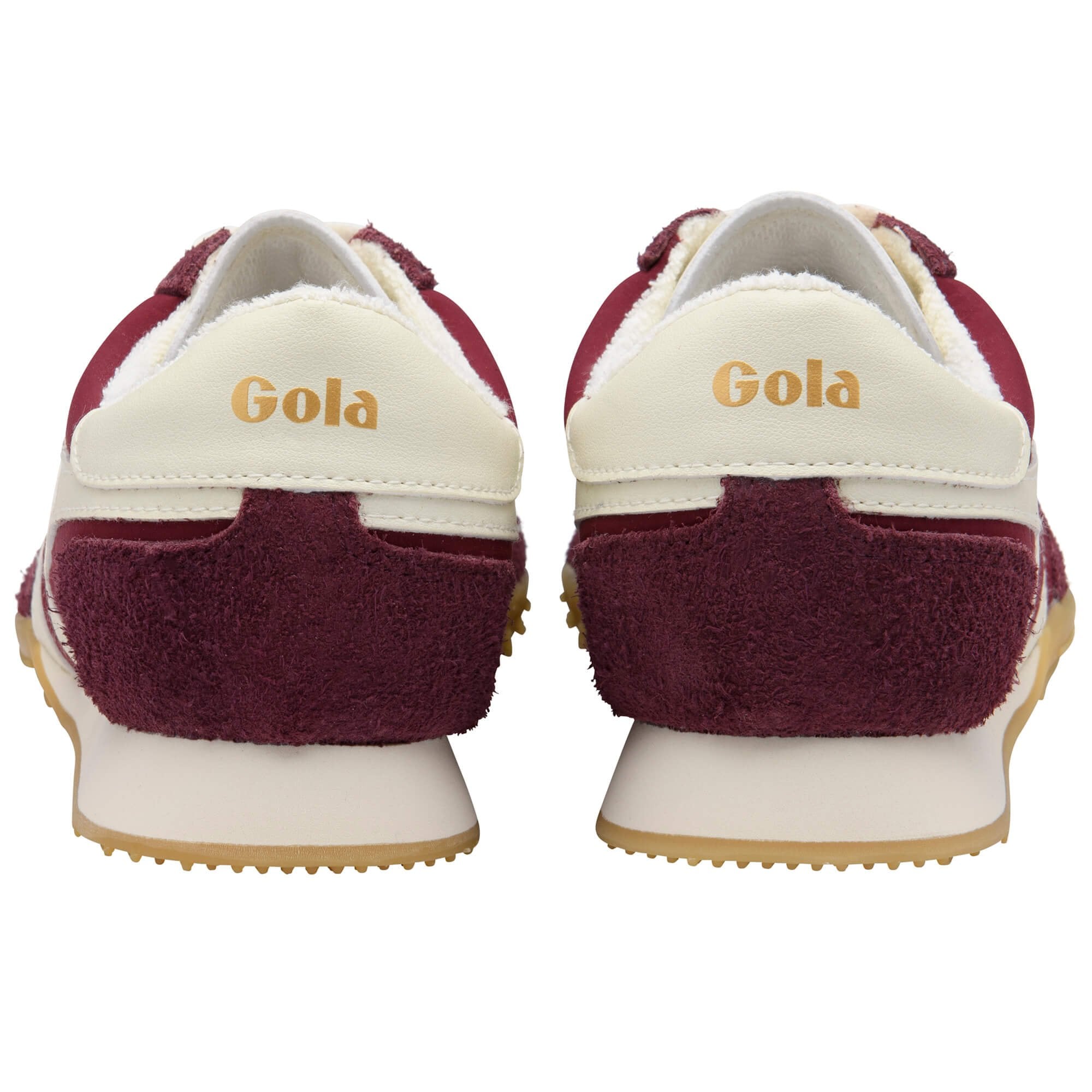 Maroon and white Gola trainers on a white background