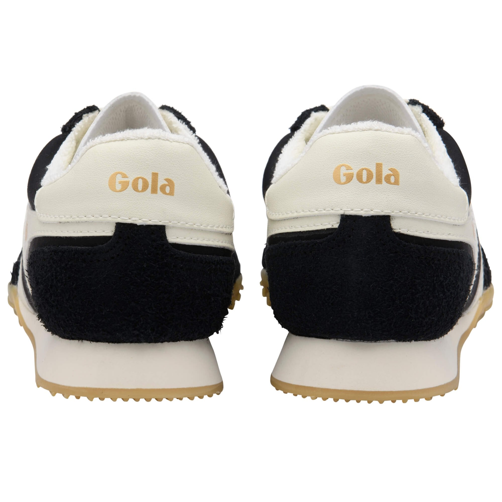 Black and white Gola trainers shown from the back on a white background