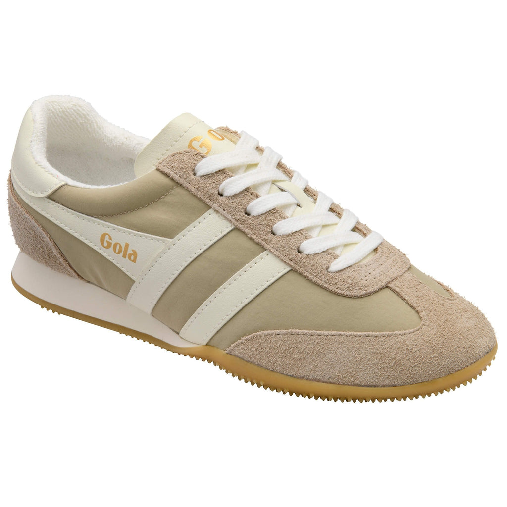 Beige trainer with white laces and sole on a white background