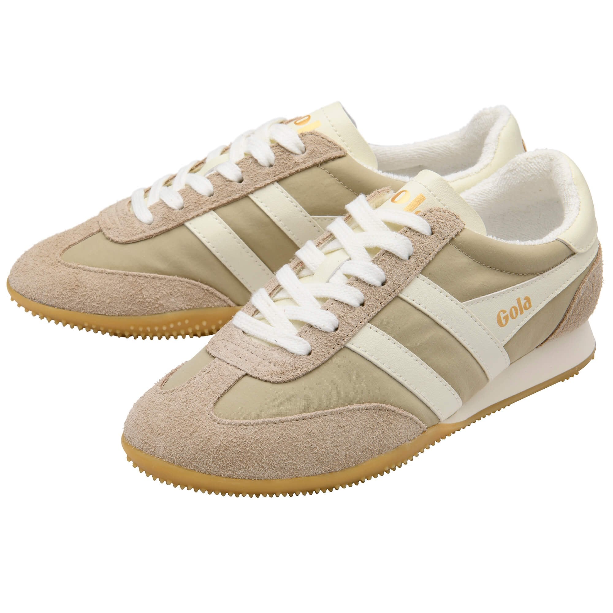 Beige and white trainers with 'Gola' branding on a white background