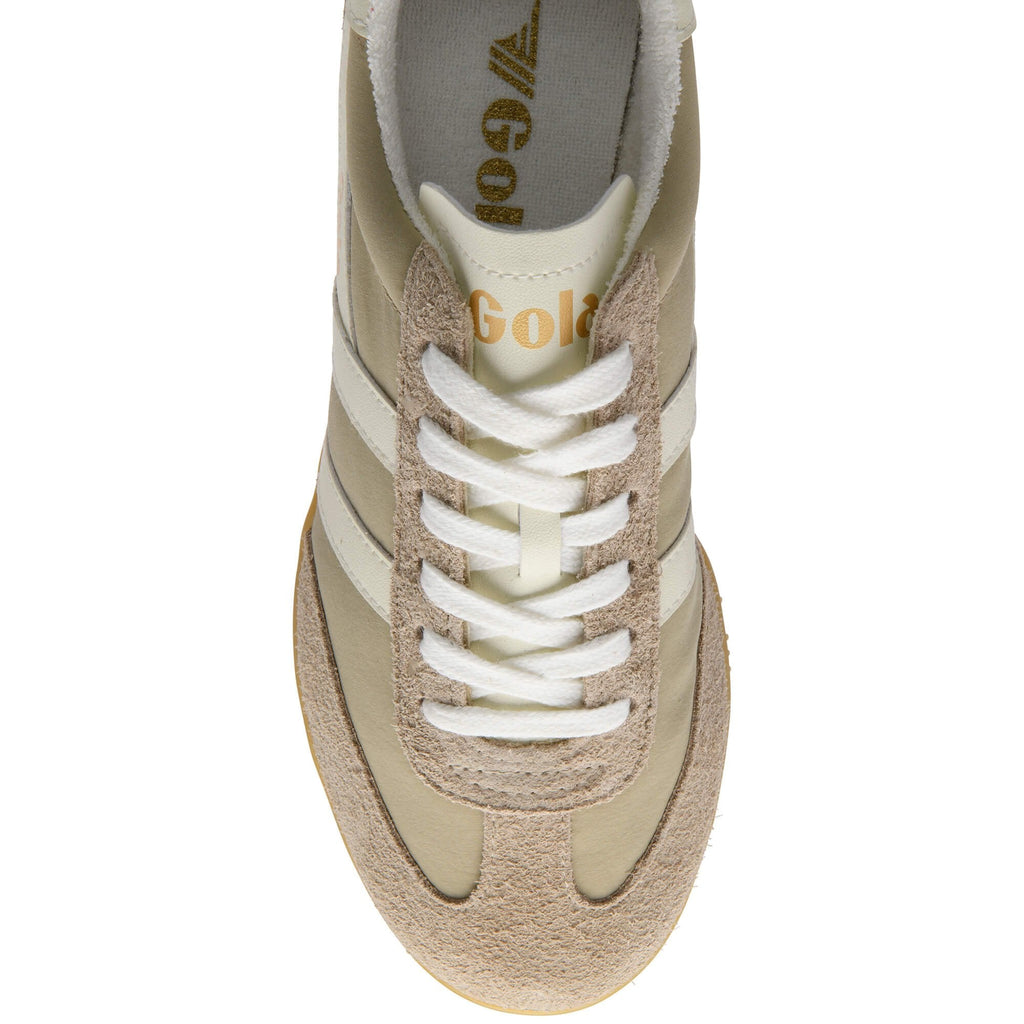 Beige trainer with white laces on a white background