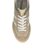 Beige trainer with white laces on a white background