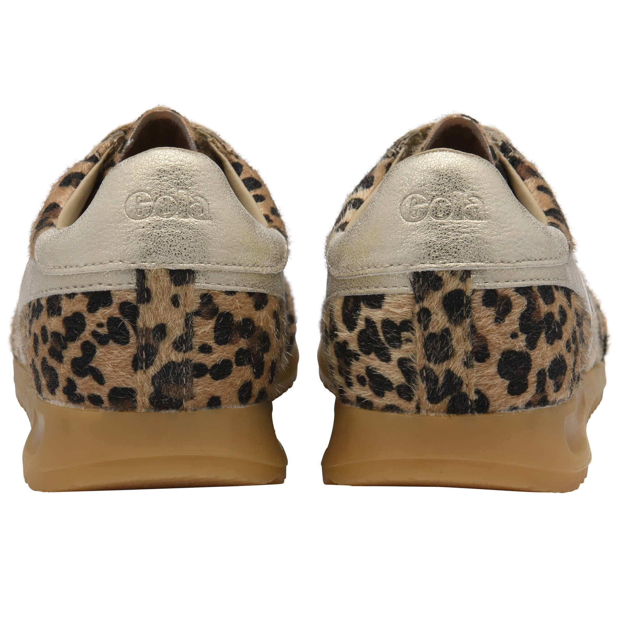 Pair of trainers with leopard print soles on a white background