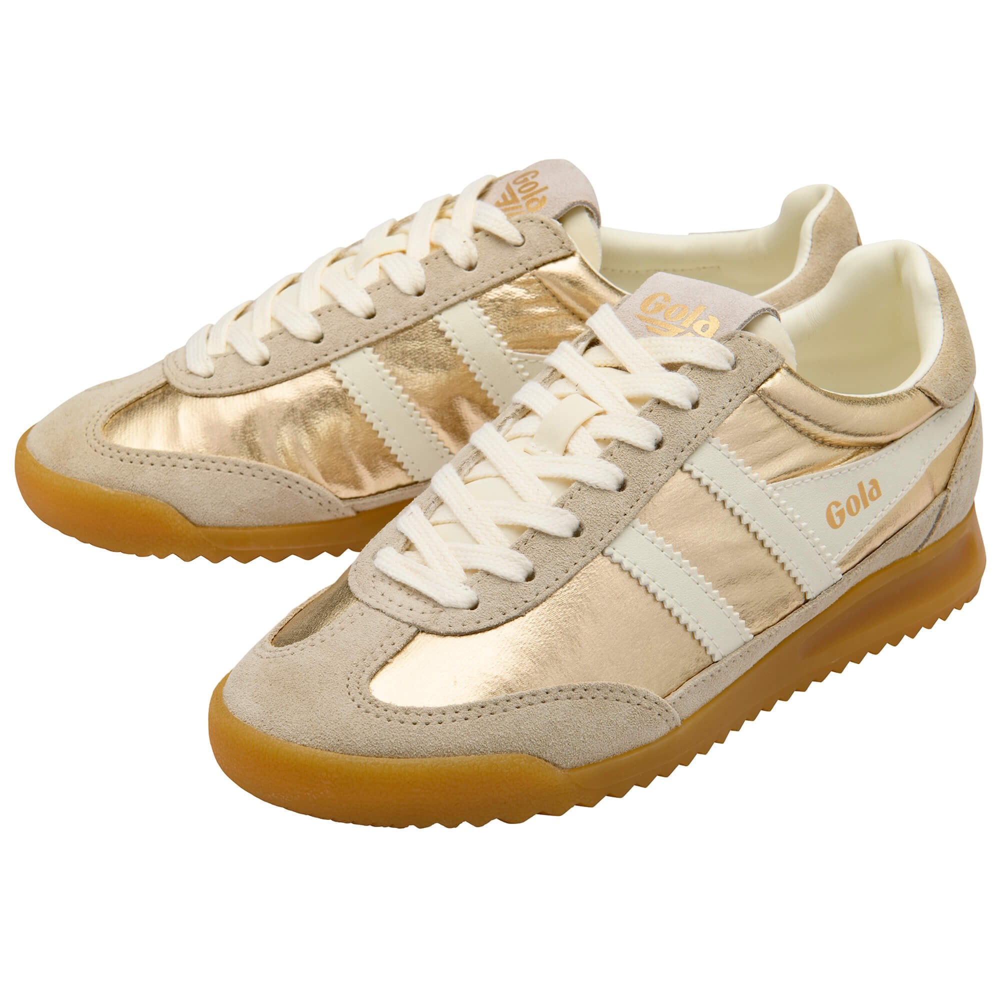 Pair of beige trainers with white laces on a white background