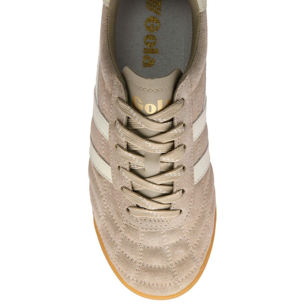 Beige sneaker with white stripes on a white background