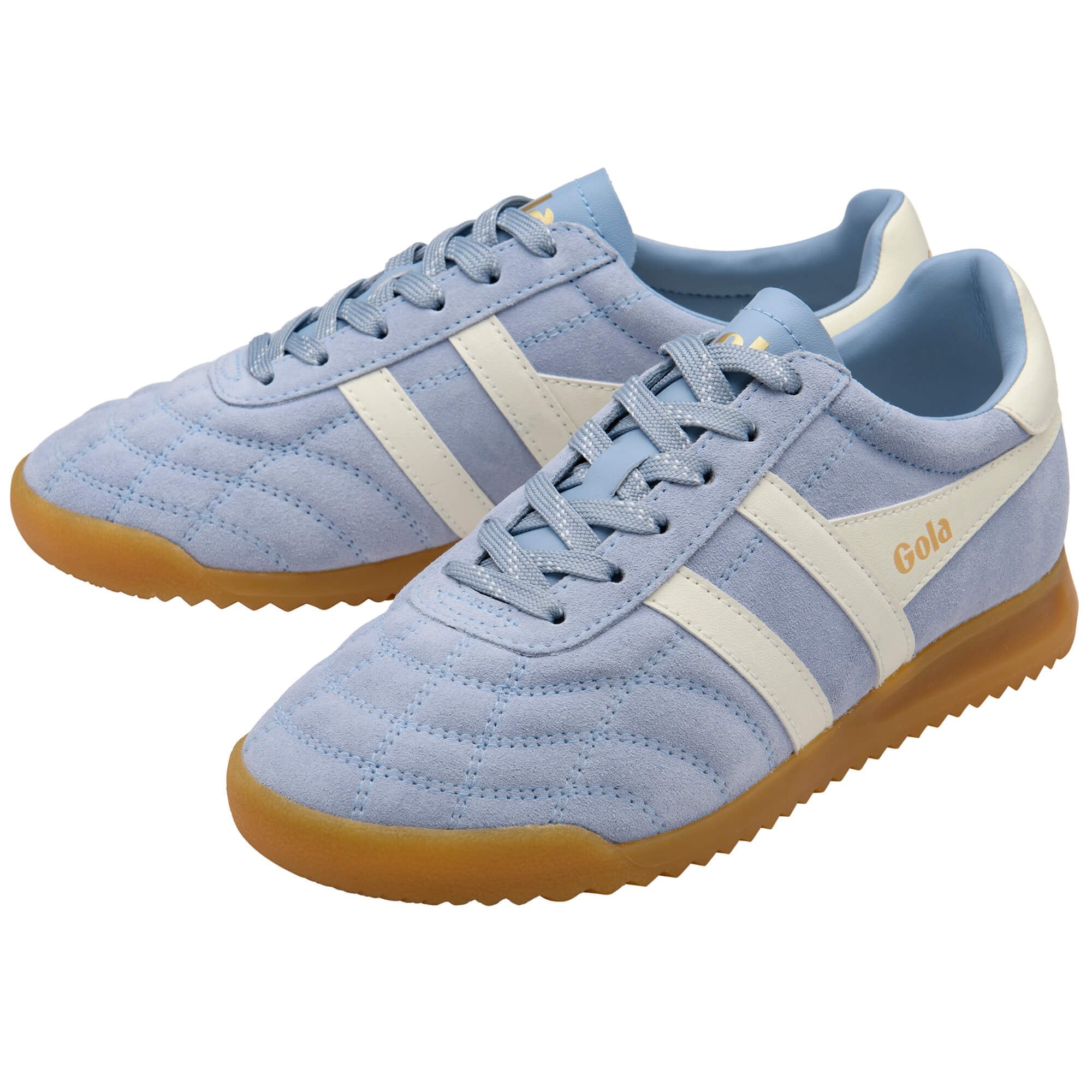 Pair of light blue suede trainers with white stripes and brown soles