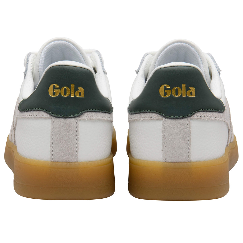 White trainers with green and gold accents on a white background