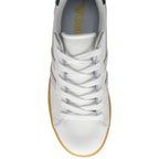 White trainer with gold sole on a white background