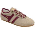 Beige trainer with maroon stripes and 'Gola' branding on a white background