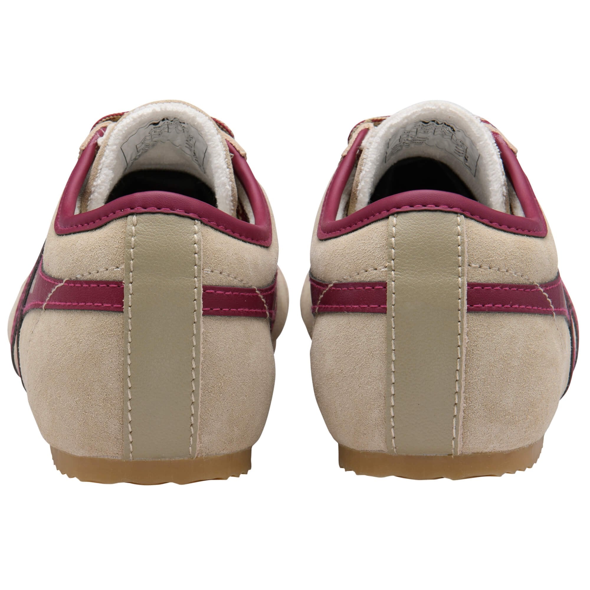 Beige trainers with red accents on a white background