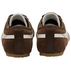 Brown trainers with white stripes on a white background