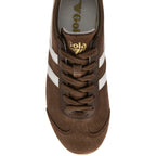 Brown trainer with white stripes and 'Gola' branding on a white background